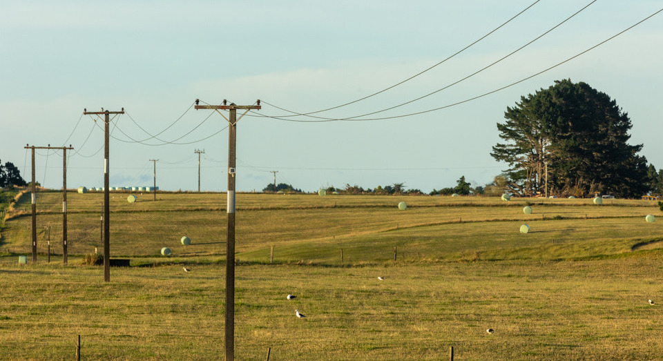 Power lines over rural landscape