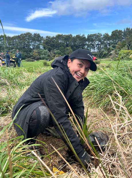 Dot Harris planting trees for Powerco